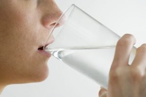 Woman Drinking Glass of Water --- Image by ? Royalty-Free/Corbis